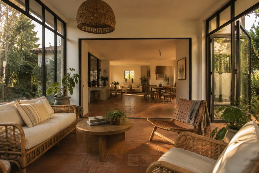 Interior of a glazed sunroom looking into the garden